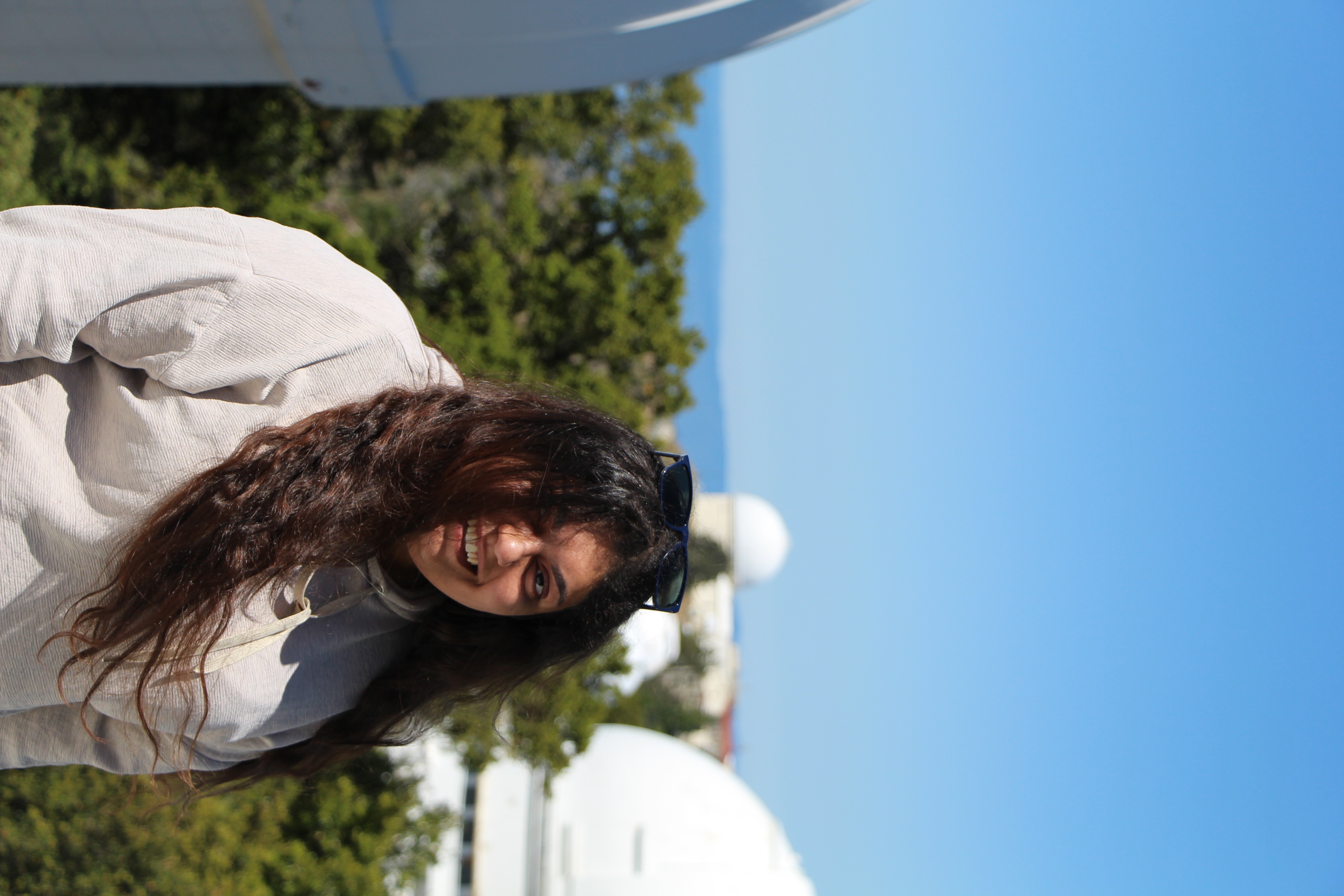 Portrait at Lick Observatory with telescope domes in the background