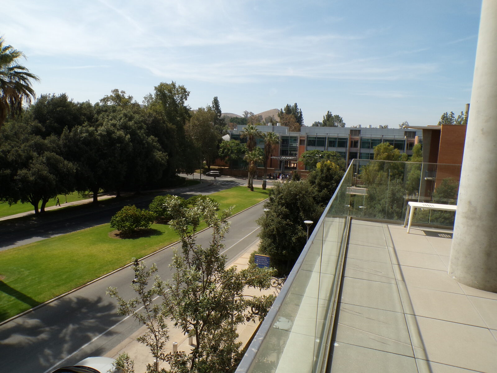 View of campus buildings and hills from a terrace at UC Riverside